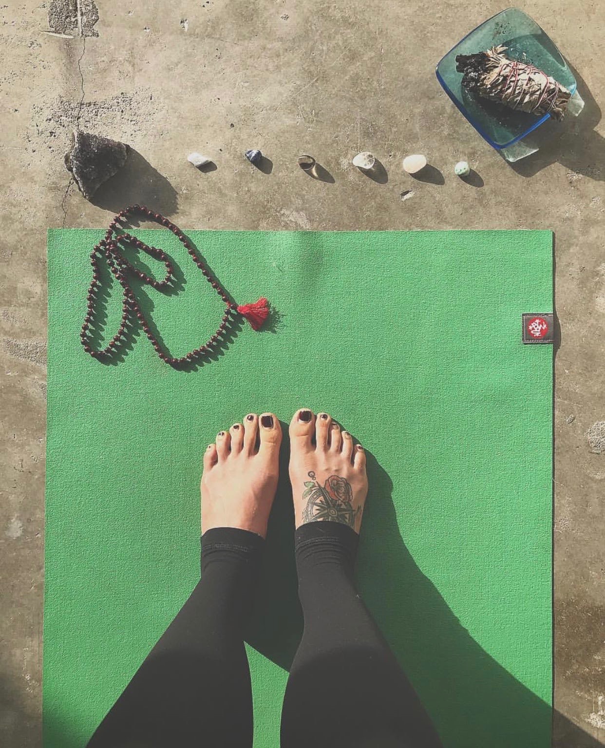 yoga mat with crystals male and sage smudging